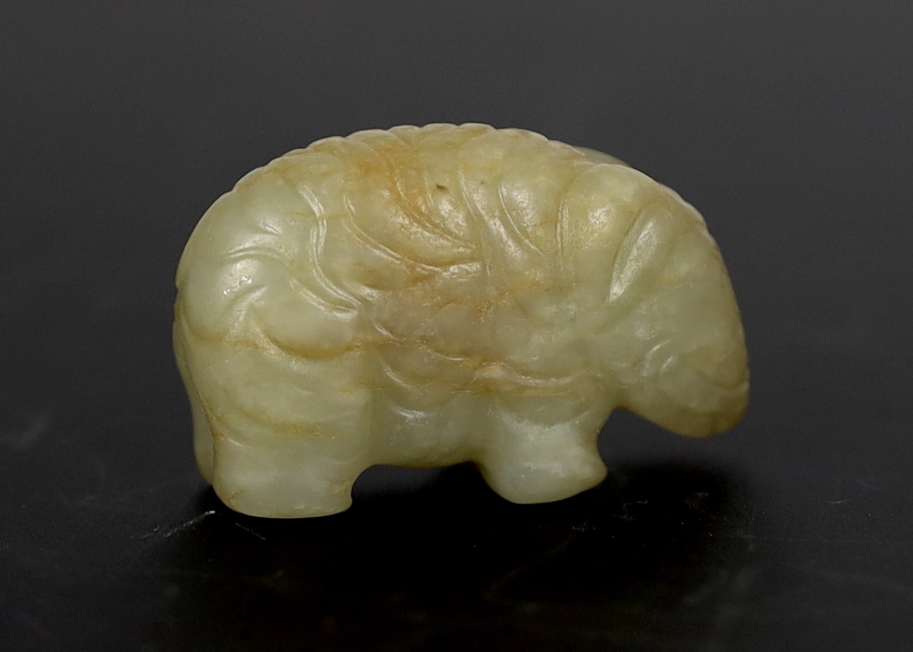 A Chinese small mellow green jade model of a standing elephant, 17th century